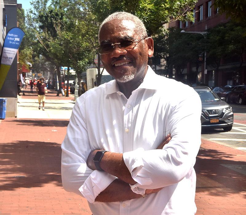 Congressman Gregory Meeks standing on a sidewalk