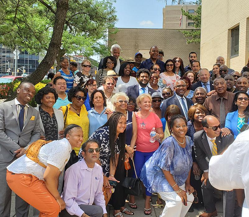 Congressman Gregory Meeks with people outside